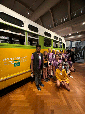 Students with Camp Counseltor in front of the Rosa Parks Bus