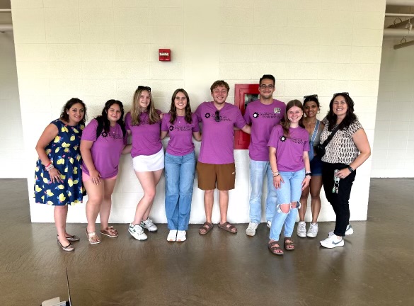 Krystal (pictured far left) poses with students during the 2024 Ohio Invention League state finals competition.